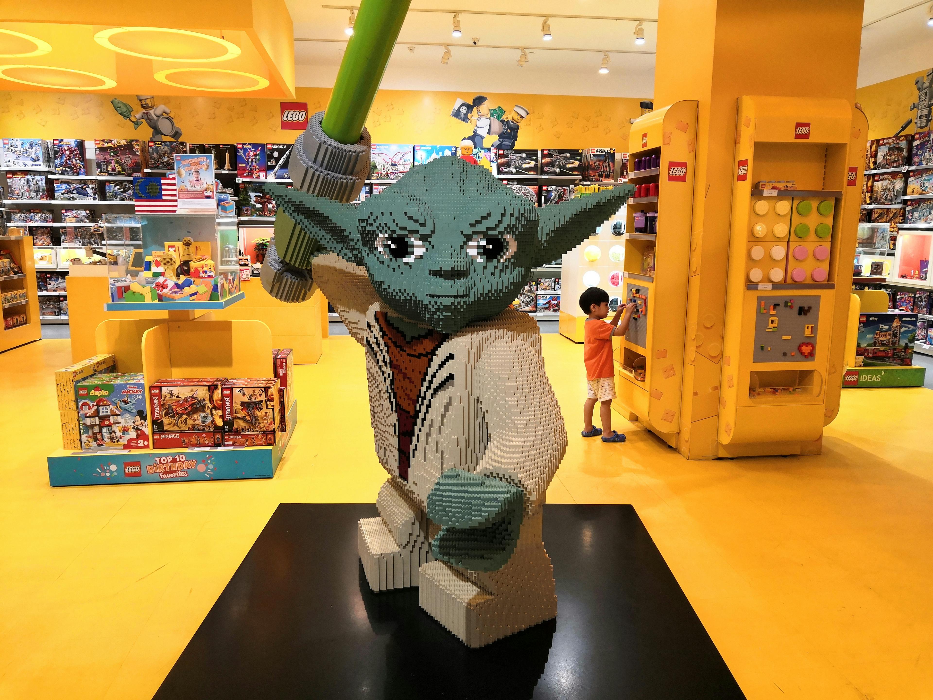 LEGO Yoda statue display in LEGO toy store at shopping mall
