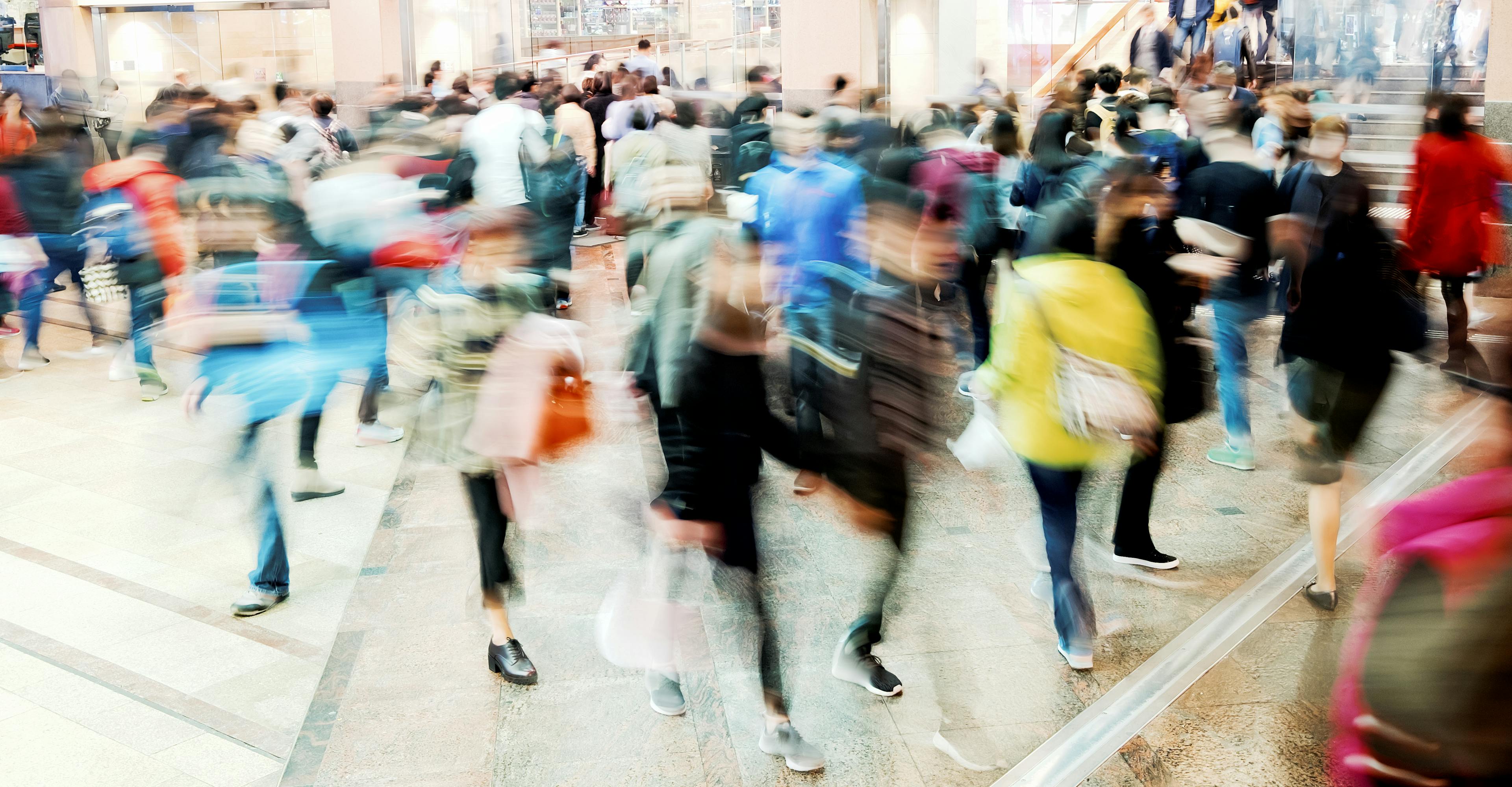 Blurred image of shoppers in mall