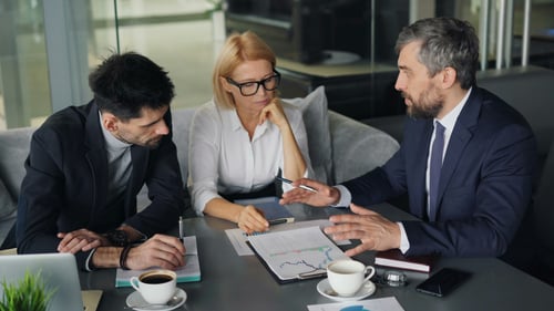 group of professionals meeting to discuss retail analytics