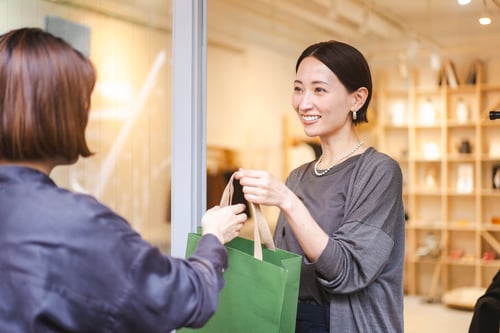 A Japanese woman works at a clothing store.