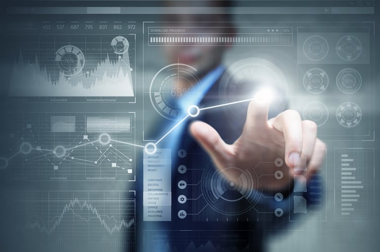 man in suit navigating a dashboard with statistics and graphs
