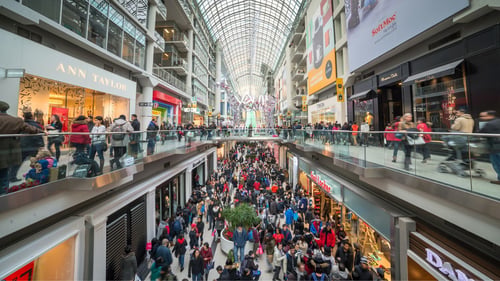 busy double-story mall filled with shoppers